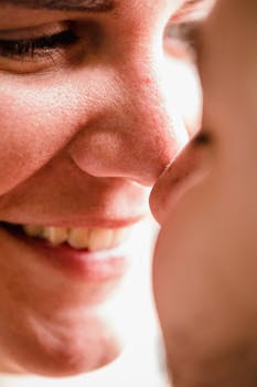 Close-up of a couple smiling and embracing with warmth and affection.